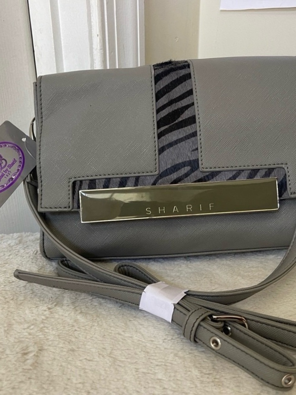 Sharif Gray Crossbody Bag with Zebra Stripe and Gold Plate